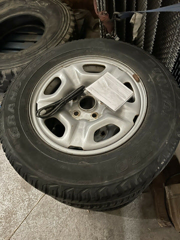 (SET OF 4) USED DUNLOP GRANDTREK AT20 P215/70R15 TIRES WITH RIM **SHIPS FREE**